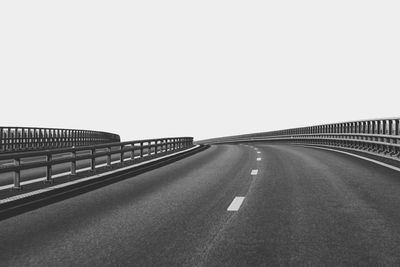 Empty road against clear sky