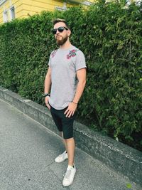 Full length of young man standing on road