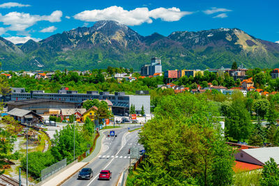 High angle view of townscape and mountains against sky