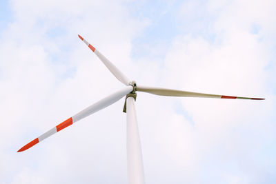 Low angle view of wind turbine against sky