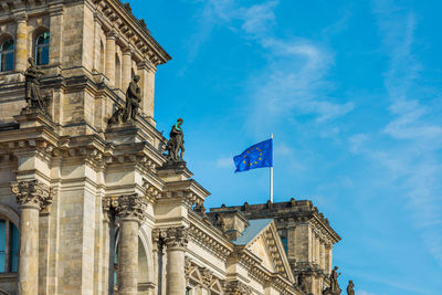 Low angle view of building against blue sky