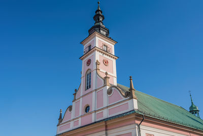 Low angle view of church against clear blue sky