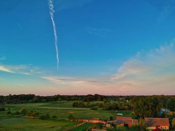 Scenic view of rural landscape against sky