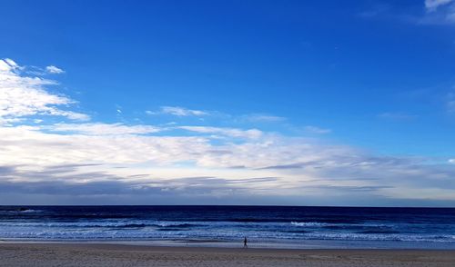 Scenic view of sea against blue sky