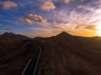 Scenic view of road against sky during sunset