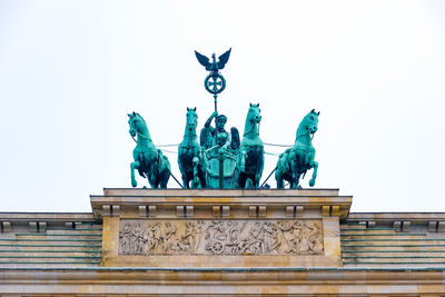Low angle view of statue against sky