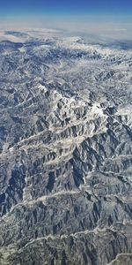 Aerial view of dramatic landscape against sky