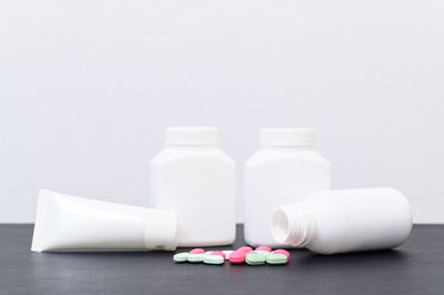 Close-up of objects on table against white background