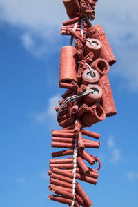 Low angle view of clothes hanging against sky