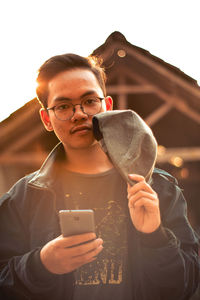 Portrait of mature man using mobile phone