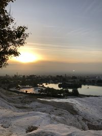 Scenic view of sunset over city