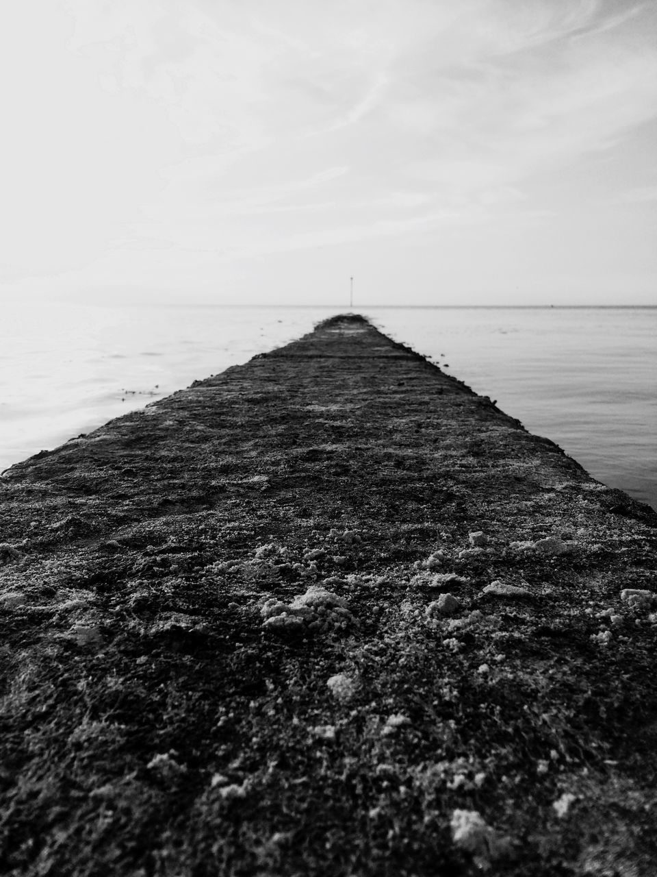 sea, sky, water, tranquil scene, tranquility, horizon over water, the way forward, scenics, nature, diminishing perspective, beach, beauty in nature, built structure, cloud, day, no people, cloud - sky, remote, outdoors, landscape