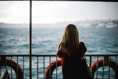 Rear view of woman looking at sea