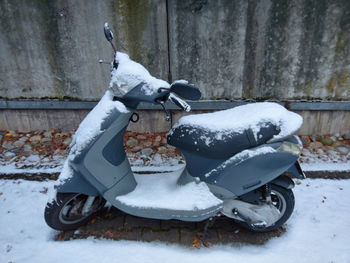 Toy car on snow covered park during winter