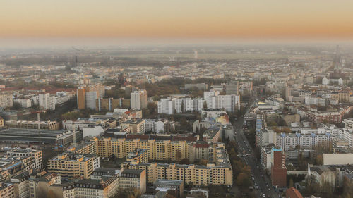 Aerial view of cityscape against sky