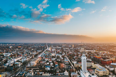 High angle view of city at sunset