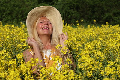 Portrait of a smiling young woman in field