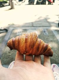 Close-up of hand holding bread