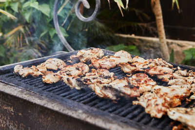 Close-up of meat on barbecue grill