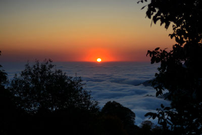 Scenic view of sea against romantic sky at sunset