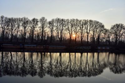 Scenic view of lake against sky during winter