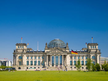 View of buildings against blue sky