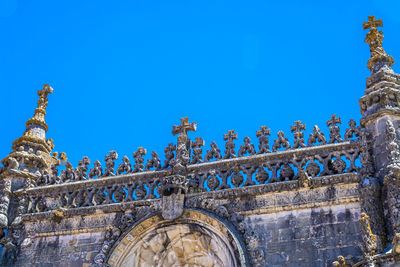 Low angle view of historical building against blue sky