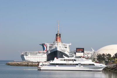 Ship in water against clear sky