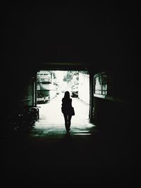 Full length of woman walking on wall