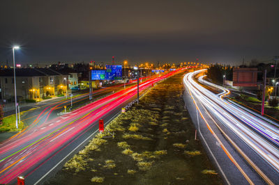 High angle view of light trails on road at night