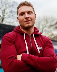 Portrait of young man standing outdoors
