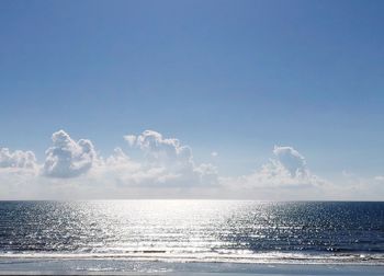 Scenic view of sea against blue sky