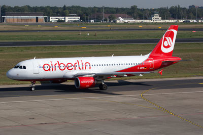 View of airplane at airport runway