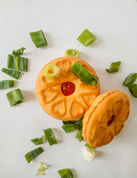 High angle view of chopped vegetables against white background