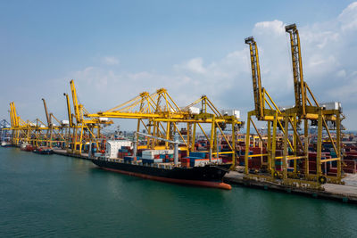Containers ship and shipping ports logistic freight load unloading by crane forwarding industry 
