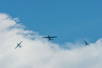 Low angle view of airshow against sky