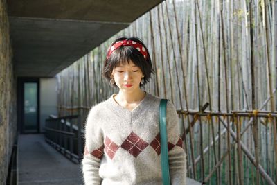 Portrait of smiling girl standing outdoors