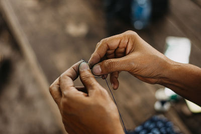 Close-up of man holding hands