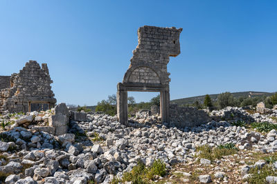 Old historical buildings against clear blue sky