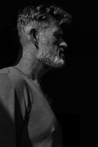 Low angle view of a man against black background