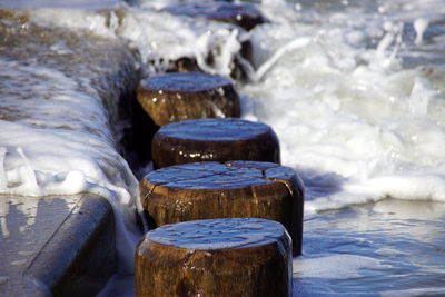 Close-up of stone stack on rocks by water