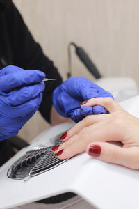 Midsection of doctor examining patient