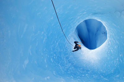 South america, chile, torres del paine national park, ice climber at grey glacier