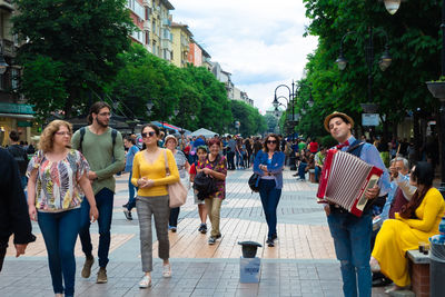 People walking on street in city