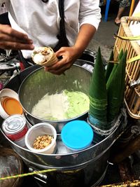 Midsection of man preparing food