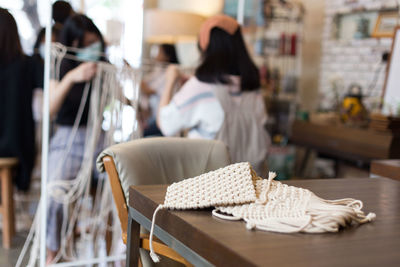 Women knitting crochets in workshop