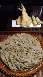 Close-up of rice in basket on table