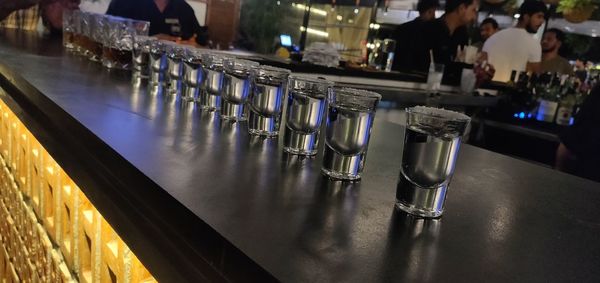 Row of wine bottles on table in restaurant