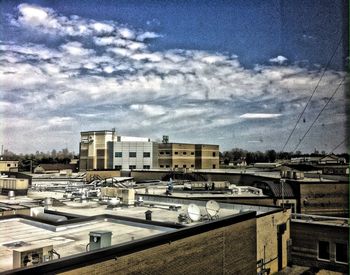 Residential buildings against cloudy sky