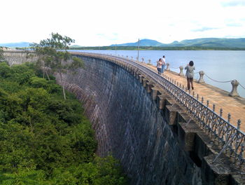 People walking on bridge